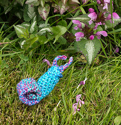 Crocheted Snail Examines Nettles