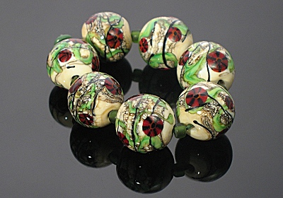 Lampwork Poppies on an ivory base Lampwork Poppies on an ivory base