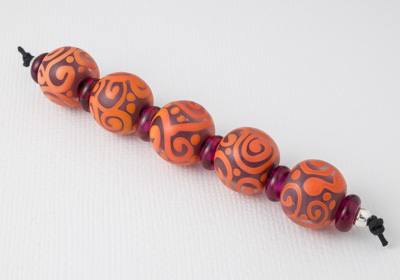 Orange Scroll Beads